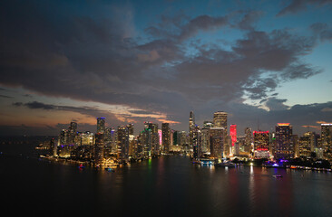 Fototapeta premium Aerial night view of Brickell skyline in downtown Miami. Skyscrapers above Miami. Scenic panorama of Brickell financial district. Brickell in Miami city. Brickell Urban landscape.