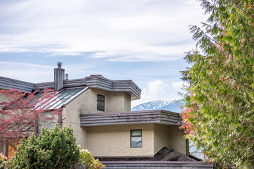 Top of luxury house with shingle roof and nice windows in Summer in Vancouver, Canada, North America. Day time on July 2025.