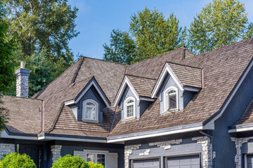 Top of luxury house with shingle roof and nice windows in Summer in Vancouver, Canada, North America. Day time on July 2025.