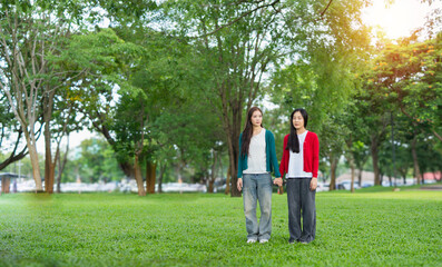 Fototapeta premium A couple holding hands in a park