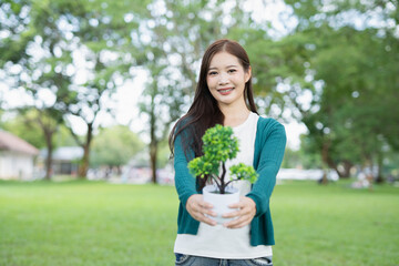 Technology,   Hands holding  globe of tropical nature summer background, 