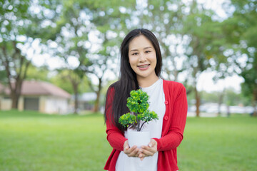 Farmer's hands planting seedlings in natural soil