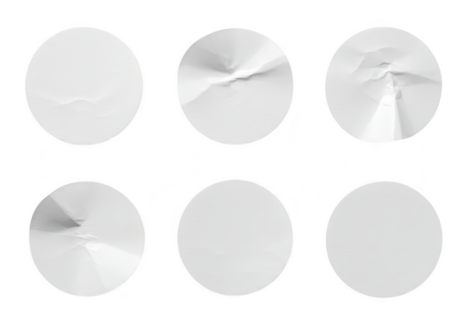 A collection of six circular stickers some with crumpled texture isolated on a transparent background