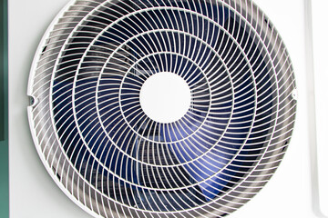 Close up of air conditioner compressor source heat pumps on white wall outdoor on roof top of building for cooling at industrial plant.  Cooling pump technology for home or office.