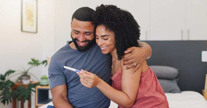 Smile, couple and hug with pregnancy test at house of positive result, good news and IVF success. Happy, people and embrace for fertility kit, family planning and pregnant announcement of future baby