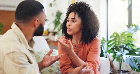 Arguing, couple and angry in home, conversation or disagreement in living room or marriage problems. Conflict, man and fight with woman, liar and people with toxic relationship, upset and emotions