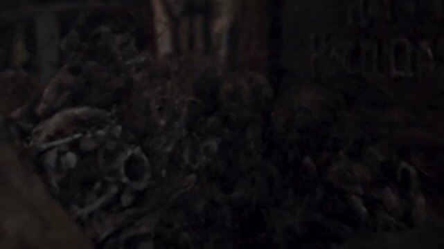 Burning Candle Amidst a Collection of Skulls for Halloween