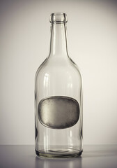 Fototapeta premium Empty glass bottle with a silver label