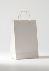 Blank white shopping bag on plain background (1)