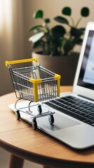 Miniature shopping cart placed on a wooden desk next to a laptop, symbolizing online shopping, e-commerce, digital retail business, and modern consumer buying trends


