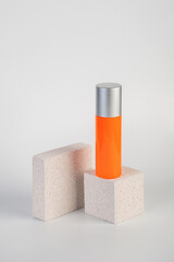 Skin care or sunscreen cosmetic with stylish props on white background.