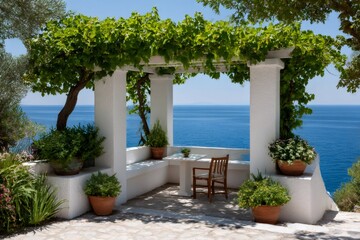 Fototapeta premium White pergola overlooking mediterranean sea with green plants and wooden chair