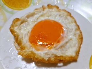 Thai deep-fried egg in white plate