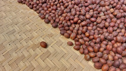 the process of drying coffee beans using traditional methods with sunlight to reduce the moisture...