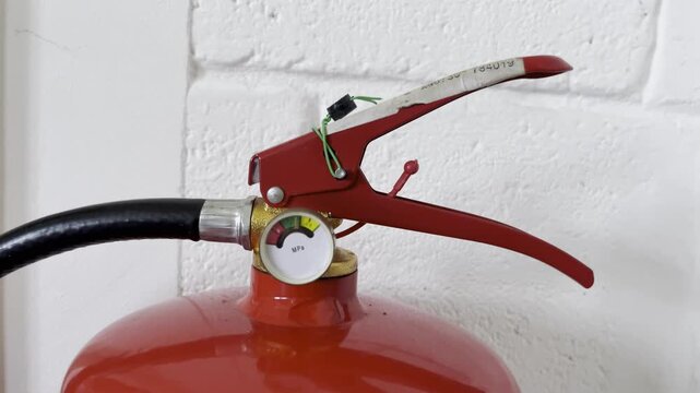 selective focus on security seal on fire extinguisher valve