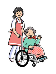 介護士と車椅子のシニア女性