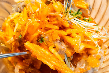 spicy cold raw fish soup called Mulhoe