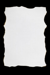 A burnt, crumpled piece of white paper on a black background