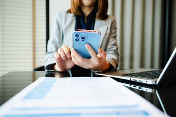 Businesswoman hand working digital marketing media in virtual screen with mobile phone and modern...