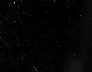 Abstract dark background with light speckles and streaks
