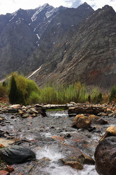 flowing mountain stream at jispa, a beautiful remote village surrounded by himalaya mountains in lahaul valley in himachal pradesh, india