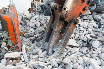 Demolition site with excavator and rubble