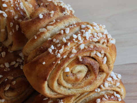 Traditional home-made  finnish cinnamon rolls on wooden background.