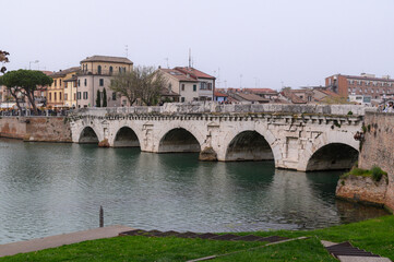 Fototapeta premium Ponte di Tiberio – Ancient Roman Bridge over Marecchia River in Rimini, Italy