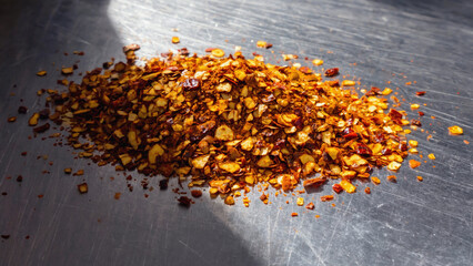 crushed dry chili flakes on surface.ai 