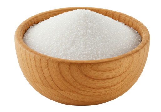Bowl of white sugar on a wooden table, with a soft-focus kitchen background