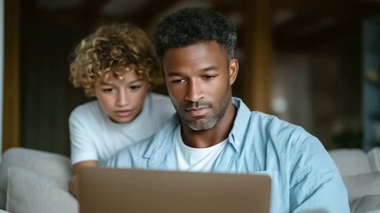 African American father helping Caucasian teen son with distance learning during online Zoom class while mother plays with daughter in living room virtual learning at home, mixed - Powered by Adobe