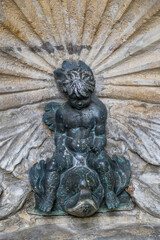 Cherub and Fish Fountain Sculpture – Symbolic Baroque Detail in Rimini, Italy