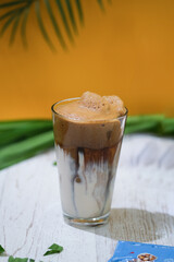 Refreshing Iced Coffee Dirty Latte: Tall Glass, Professional Drink Photography for Cafes. Vertical