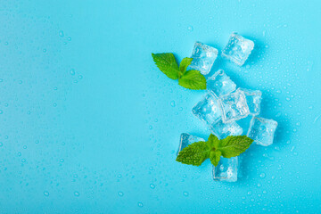Mint and ice on texture background. Green fresh mint and ice cube. Mint leaves, ice cube and water...