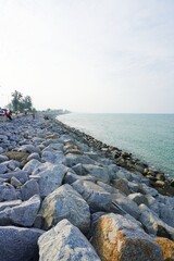 a rock cliff arranged to prevent wave erosion.  tetrapods photo Arranged randomly to prevent...