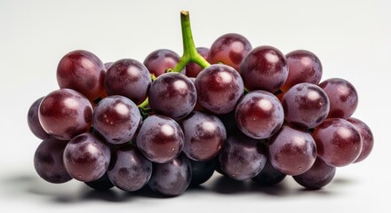 Fototapeta premium Close-up of a bunch of plump, dark-purple grapes