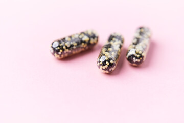 Iron capsules on bright background. Soft focus. Close up. Copy space.	