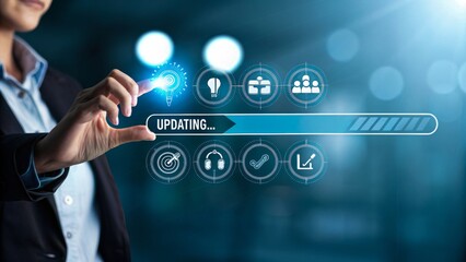 Fototapeta premium A person touching a futuristic holographic interface with an Updating progress bar, glowing icons above, dark blurred background.