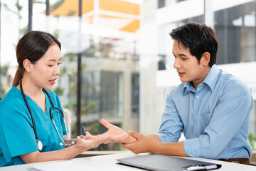 Medical, hand wrist pain and a man with doctor in the hospital, talking during a consultation....