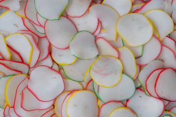 Thinly sliced, dried raw crackers ready to be fried