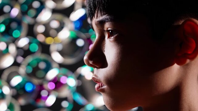 Teen Boy in Profile with Intense Determined Stare

