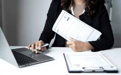Obraz premium Business woman employer holding resume hiring recruit looking cv resume to hire candidates, analyzing information before job interview. Recruitment concepts