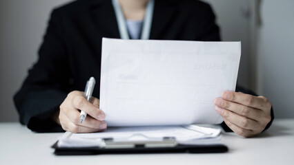 Business woman employer holding resume hiring recruit looking cv resume to hire candidates,...