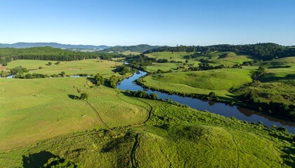Lush green valley with winding river