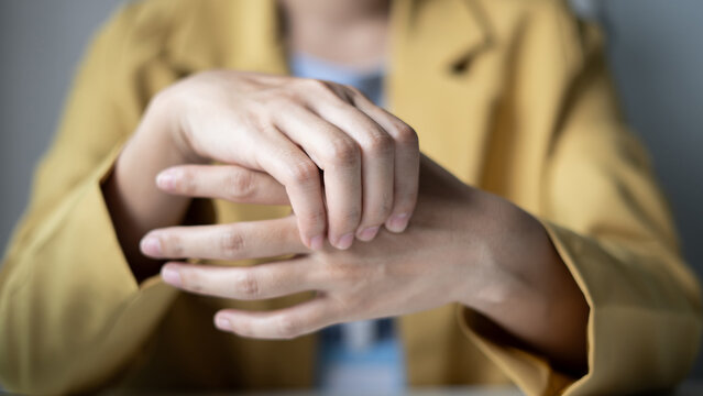 Woman hand with wrist pain numbness and pain in the palm of the hand has pain and tingling in the nerve endings This is a side effect of sitting and working for a long time on a laptop at the office