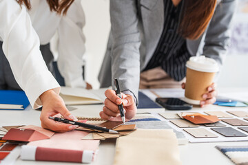 Interior design, two working colleagues designers, or decorator and client choosing finishing...
