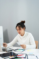 Website designer, Creative planning phone app development template layout framework wireframe design, User experience concept, Young asian UX designer working on smartphone application at office.