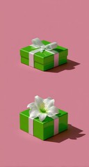 Obraz premium Two identical green gift boxes with white ribbon, one atop the other, on a pink background, with a white flower on the bottom box