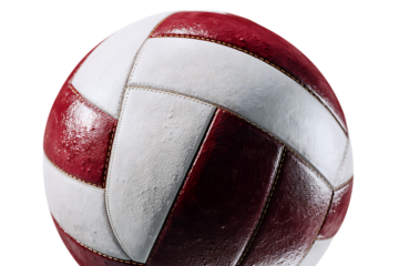 Close-up of a vintage volleyball. Red and white panels, textured leather.