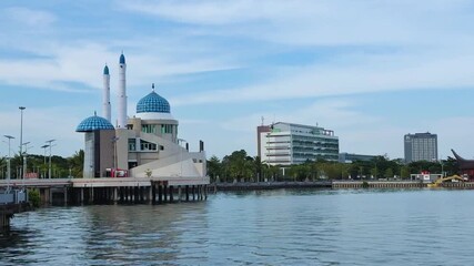 Morning view of the Amirul Mukminin floating mosque and reflections in Makassar ,Sulawesi, Indonesia